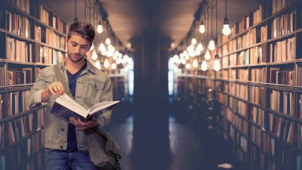 College student in a library, symbolizing eligibility for Las Vegas Students & Teachers Rates on travel.