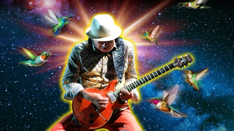 Carlos Santana playing electric guitar during a live concert at Mandalay Bay in Las Vegas